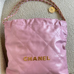 CHANEL Handbag Chanel 22 Pink Shiny Calfskin Quilted Drawstring Bag Small GHW - Redeluxe