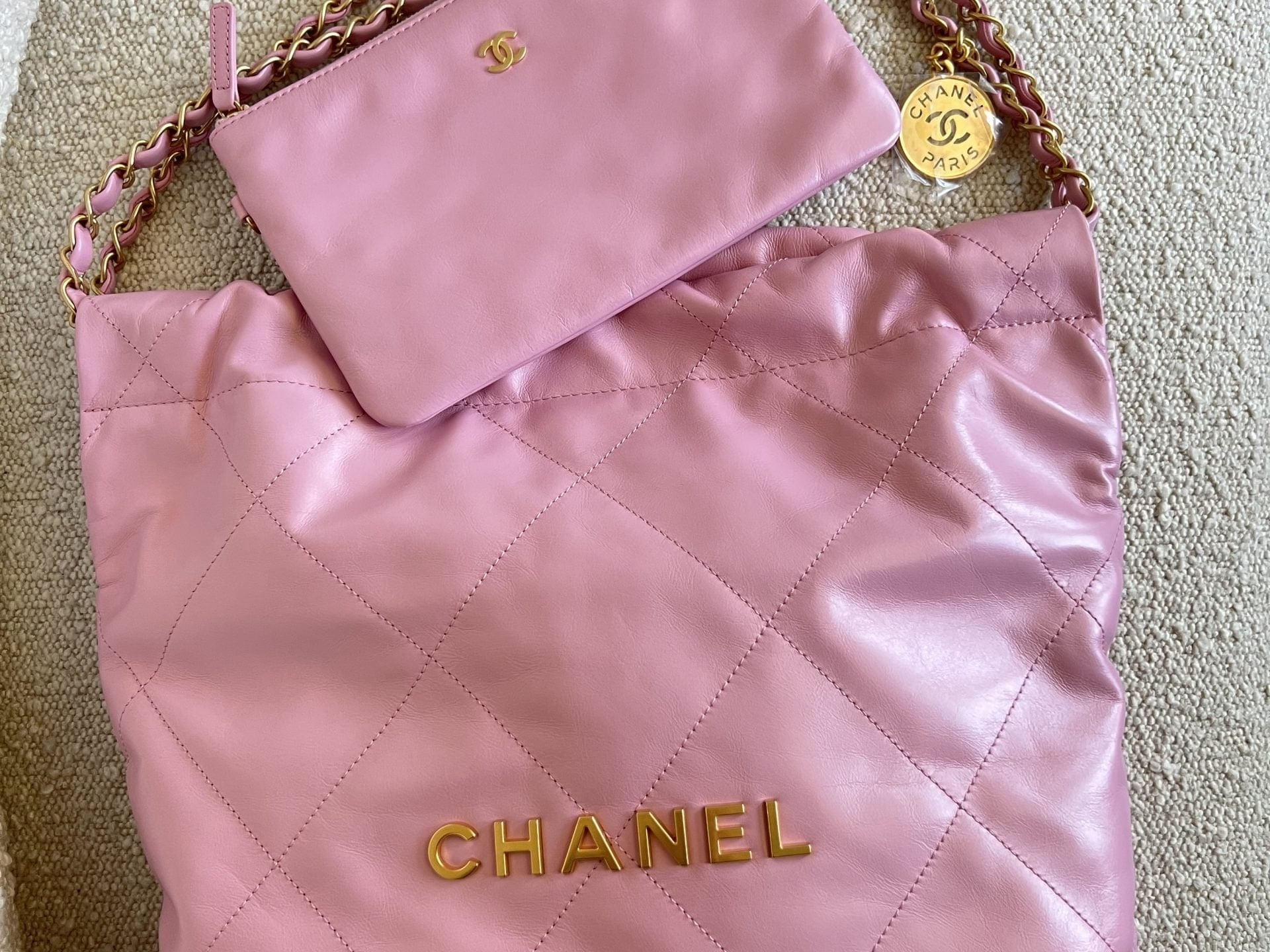 CHANEL Handbag Chanel 22 Pink Shiny Calfskin Quilted Drawstring Bag Small GHW - Redeluxe