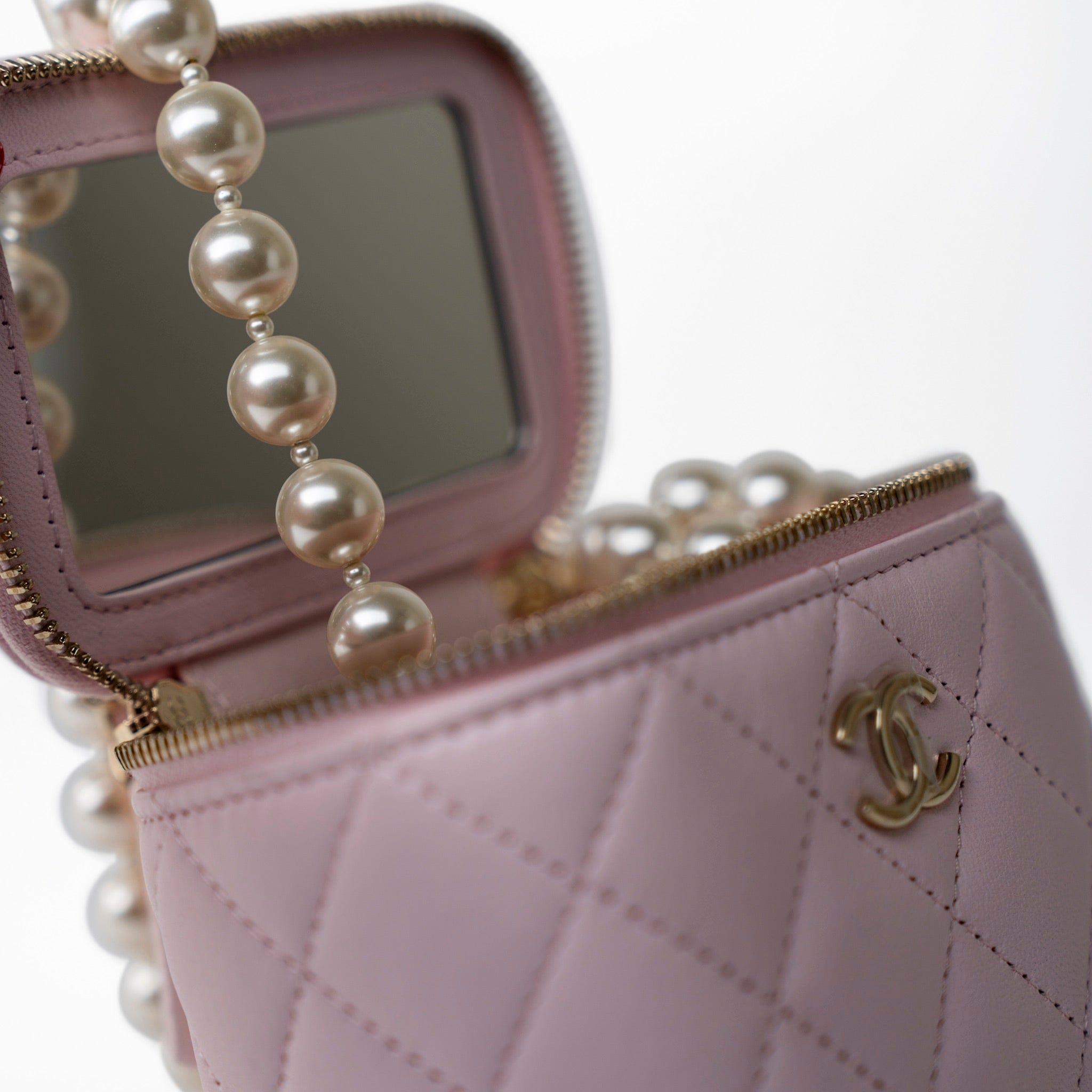 CHANEL Handbag Pink Light Pink Lambskin Quilted Mini Vanity Case With Pearl Chain - Redeluxe