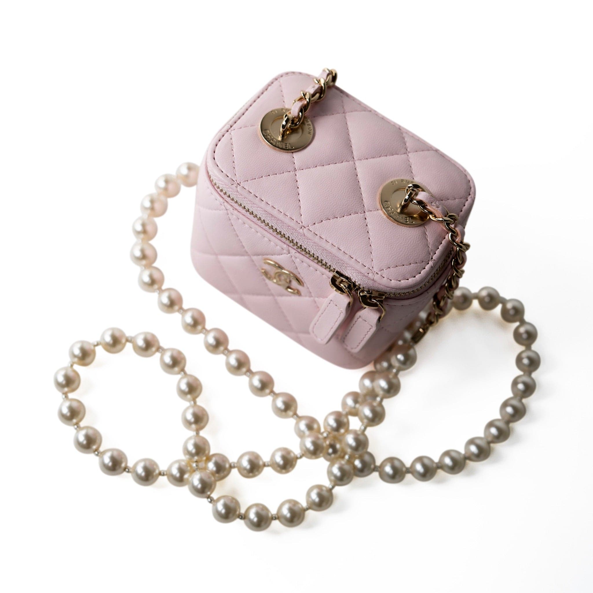 CHANEL Handbag Pink Light Pink Lambskin Quilted Mini Vanity Case With Pearl Chain - Redeluxe