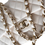 CHANEL Handbag White 21S Jumbo White Caviar Quilted Classic Flap Light Gold Hardware - Redeluxe