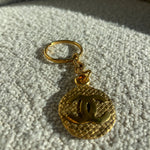 CHANEL Key Holder Gold Chanel Vintage Gold-tone Metal Round Coco Mark Charm Keyholder - Redeluxe