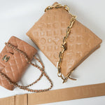 Louis Vuitton Handbag Brown Louis Vuitton Monogram Coussin PM Camel Lambskin Embossed - Redeluxe