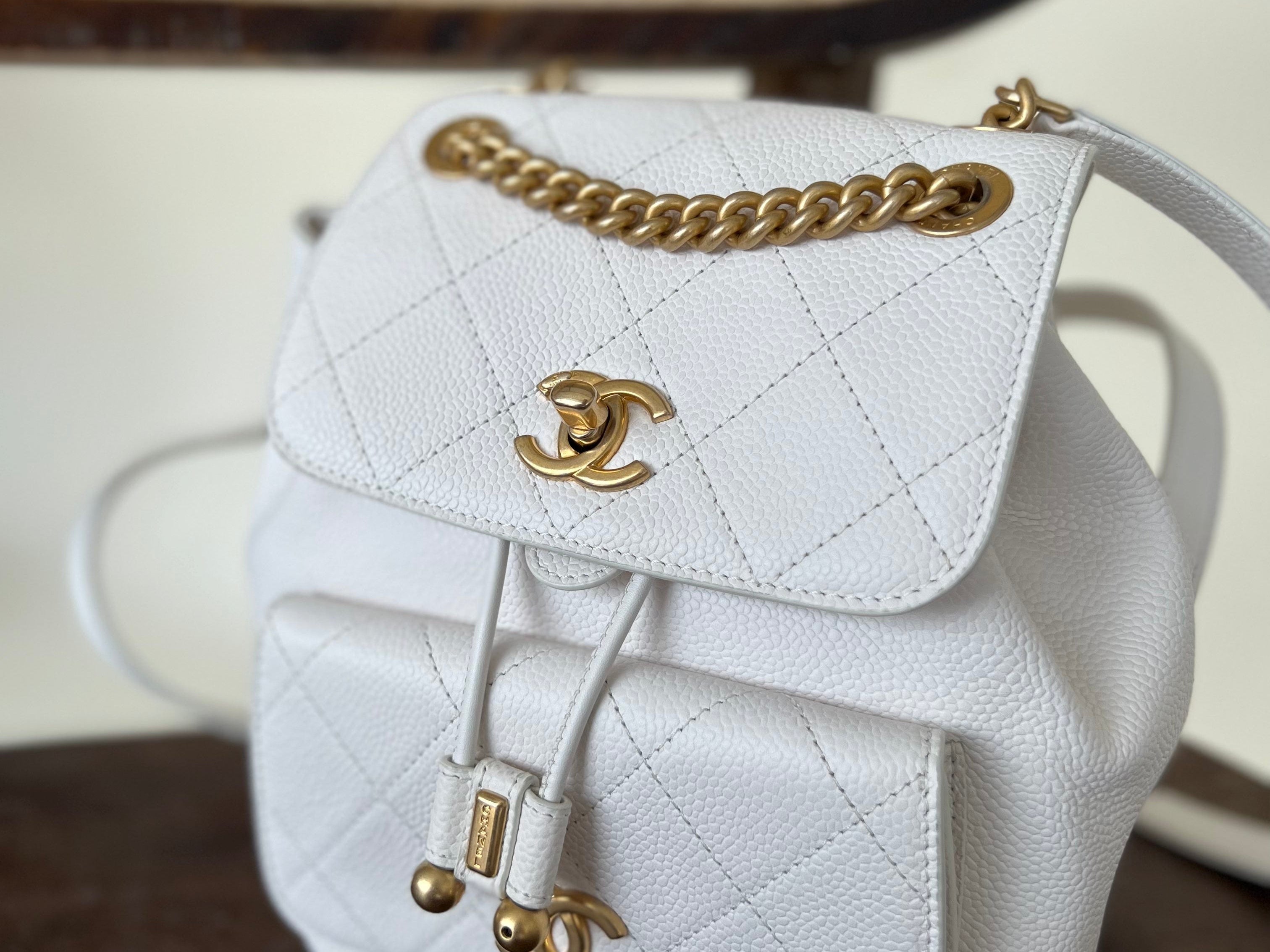 CHANEL Backpack White Caviar Quilted BackPack w/ Aged Gold Hardware - Redeluxe