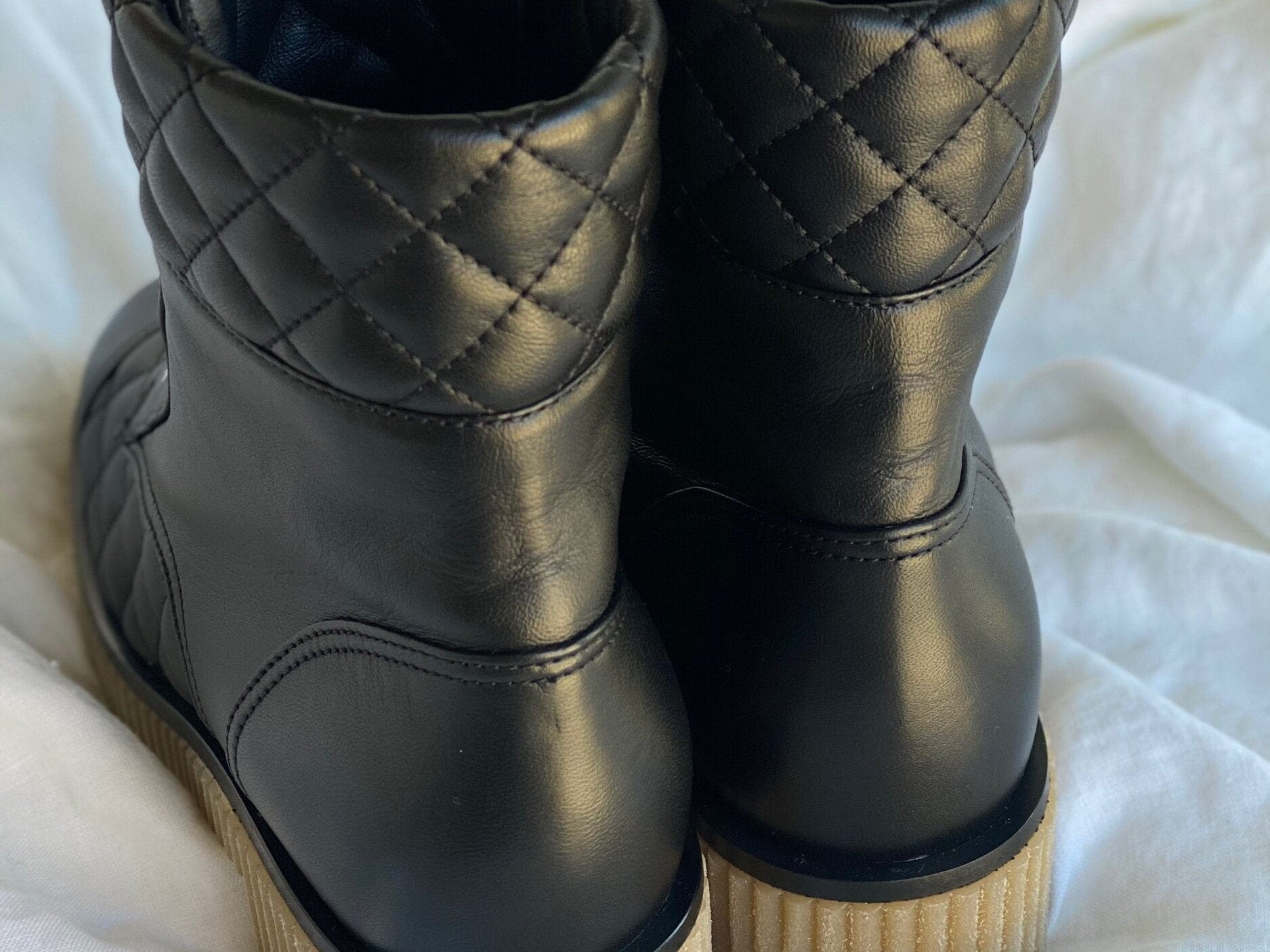 CHANEL Boots CHANEL 21B Calfskin Quilted Black Caviar Quilted CC Logo Combat Boots - Redeluxe