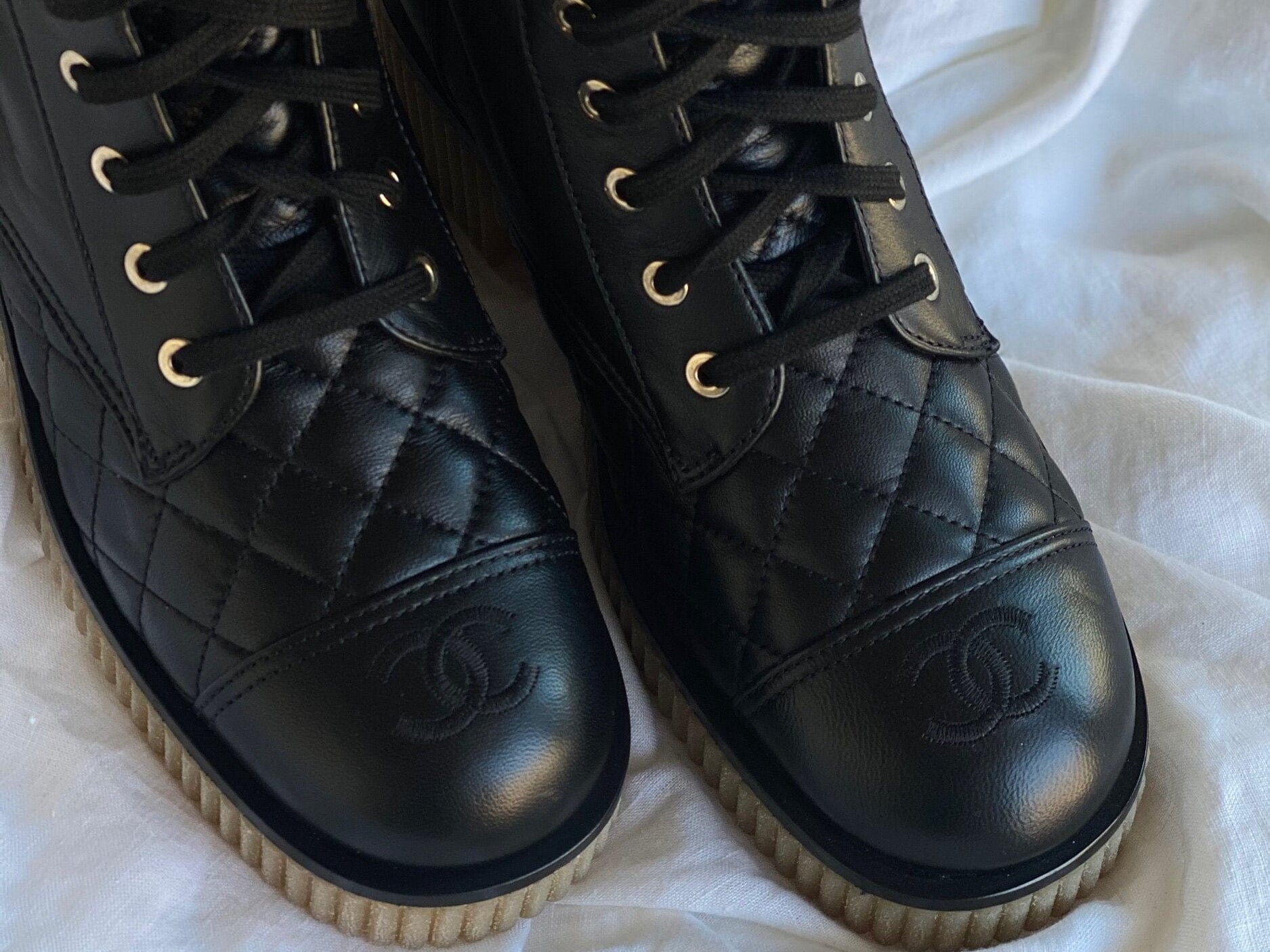 CHANEL Boots CHANEL 21B Calfskin Quilted Black Caviar Quilted CC Logo Combat Boots - Redeluxe