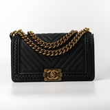 CHANEL Crossbody Black Caviar Chevron Boy Bag Medium Entwined Leather Aged Gold Hardware - Redeluxe