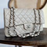 CHANEL Handbag 20B Ivory Caviar Quilted Classic Flap Medium Silver Hardware - Redeluxe