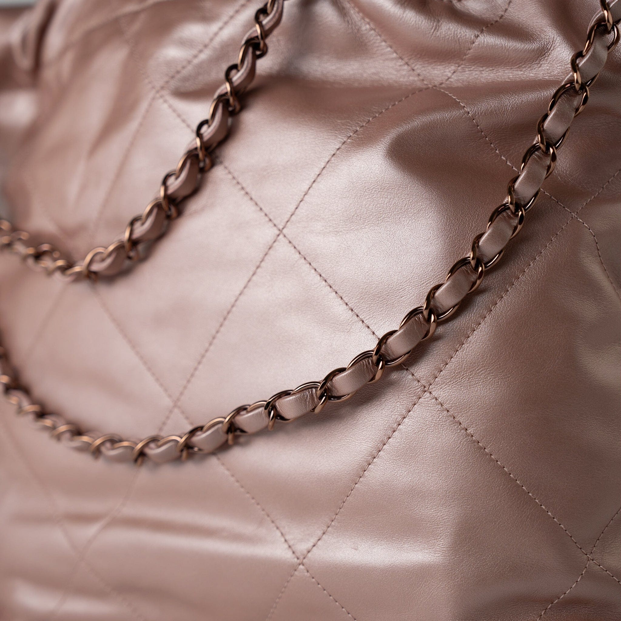 CHANEL Handbag 22A Metallic Pink / Rose Calfskin Quilted 22 Bag Drawstring Bag Small Rose Gold Hardware - Redeluxe