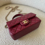 CHANEL Handbag 22A Mini Burgundy Lambskin Quilted Single Flap with Top handle Light Gold Hardware - Redeluxe