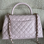 CHANEL Handbag 22P Light Pink Caviar Quilted Coco Handle Medium LGHW - Redeluxe