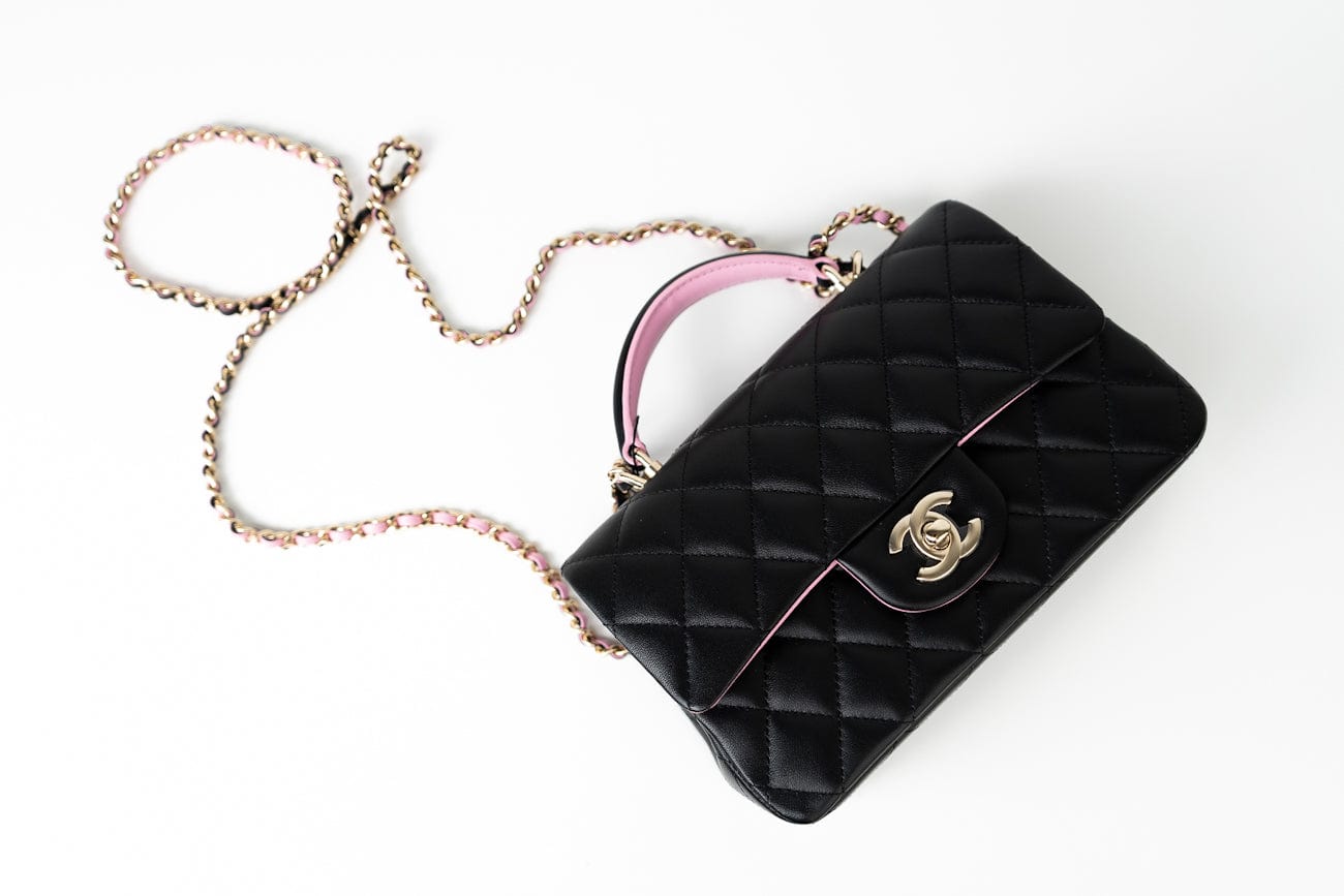 CHANEL Handbag 23P Mini Top Handle Black/Pink Lambskin Quilted w/ Light Gold Hardware - Redeluxe