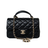 CHANEL Handbag Black 23A Black Lambskin Mini Top Handle Light Gold Hardware - Redeluxe
