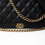 CHANEL Handbag Black Black Caviar Quilted Boy Wallet on Chain (WOC) Antique Gold Hardware - Redeluxe