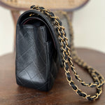 CHANEL Handbag Black Black Caviar Quilted Jumbo Classic Flap Gold Hardware - Redeluxe