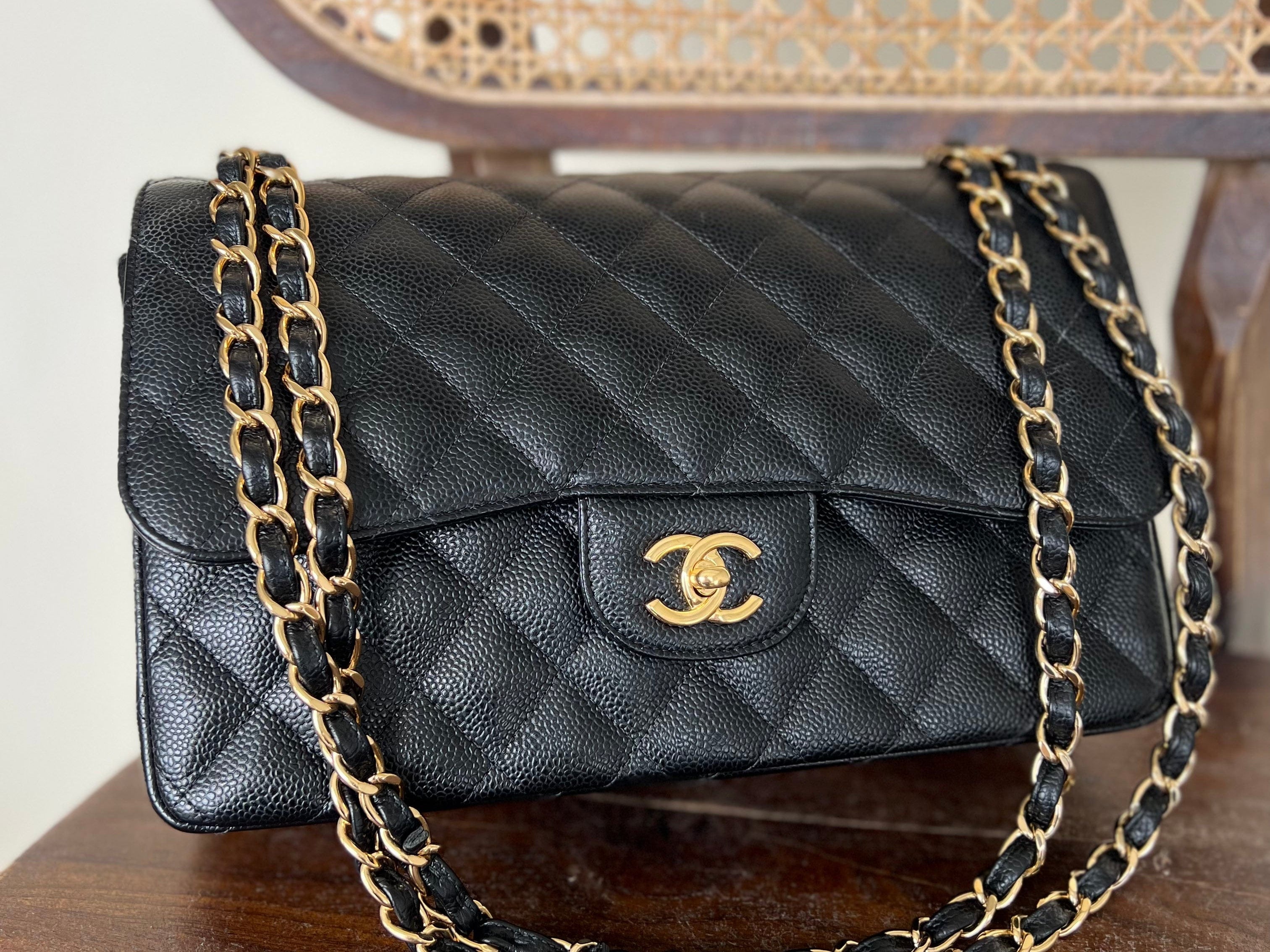 CHANEL Handbag Black Black Caviar Quilted Jumbo Classic Flap Gold Hardware - Redeluxe