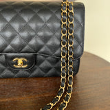 CHANEL Handbag Black Black Caviar Quilted Jumbo Classic Flap Gold Hardware - Redeluxe