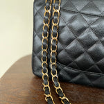 CHANEL Handbag Black Black Caviar Quilted Jumbo Classic Flap Gold Hardware - Redeluxe