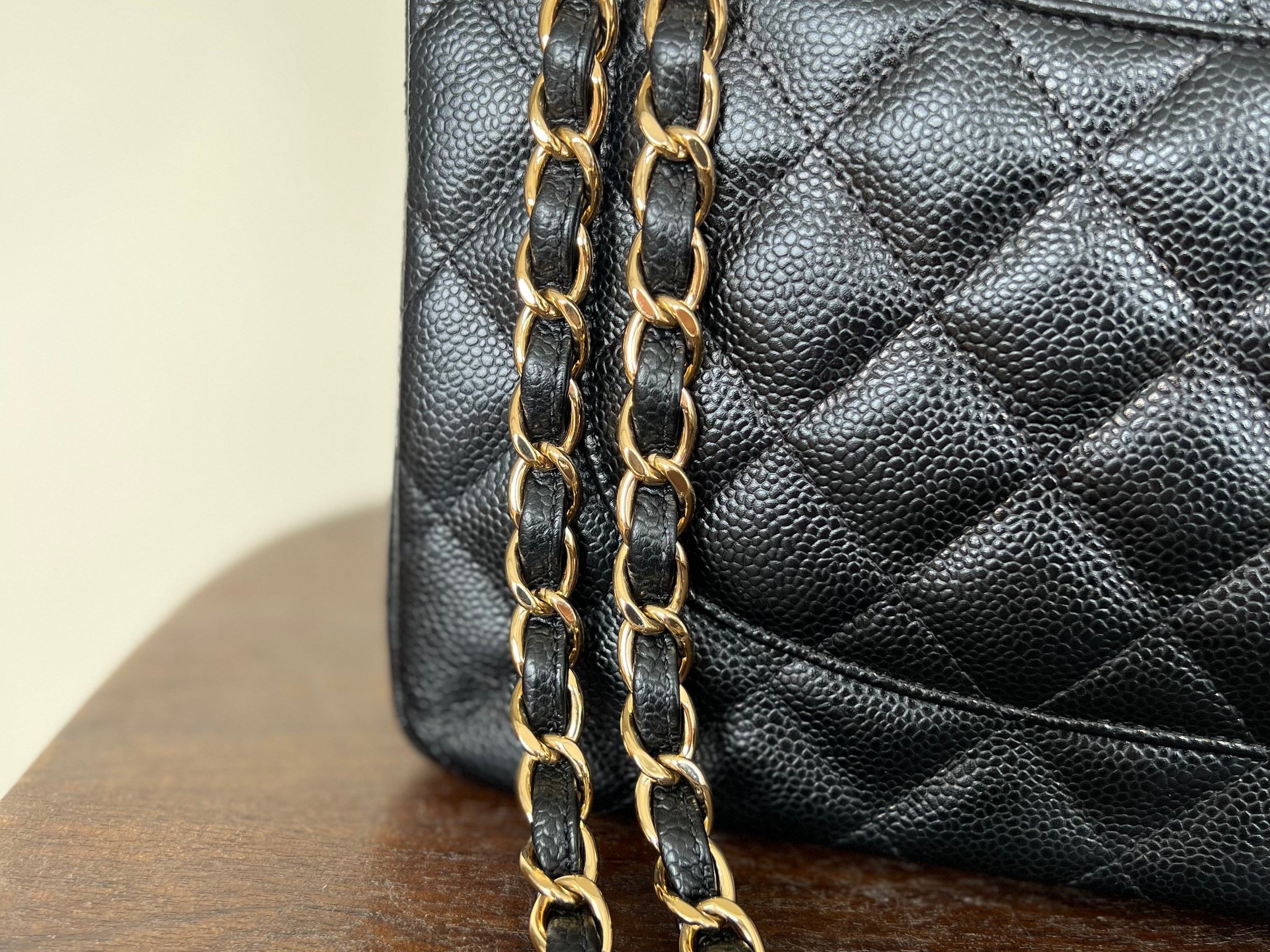 CHANEL Handbag Black Black Caviar Quilted Jumbo Classic Flap Gold Hardware - Redeluxe