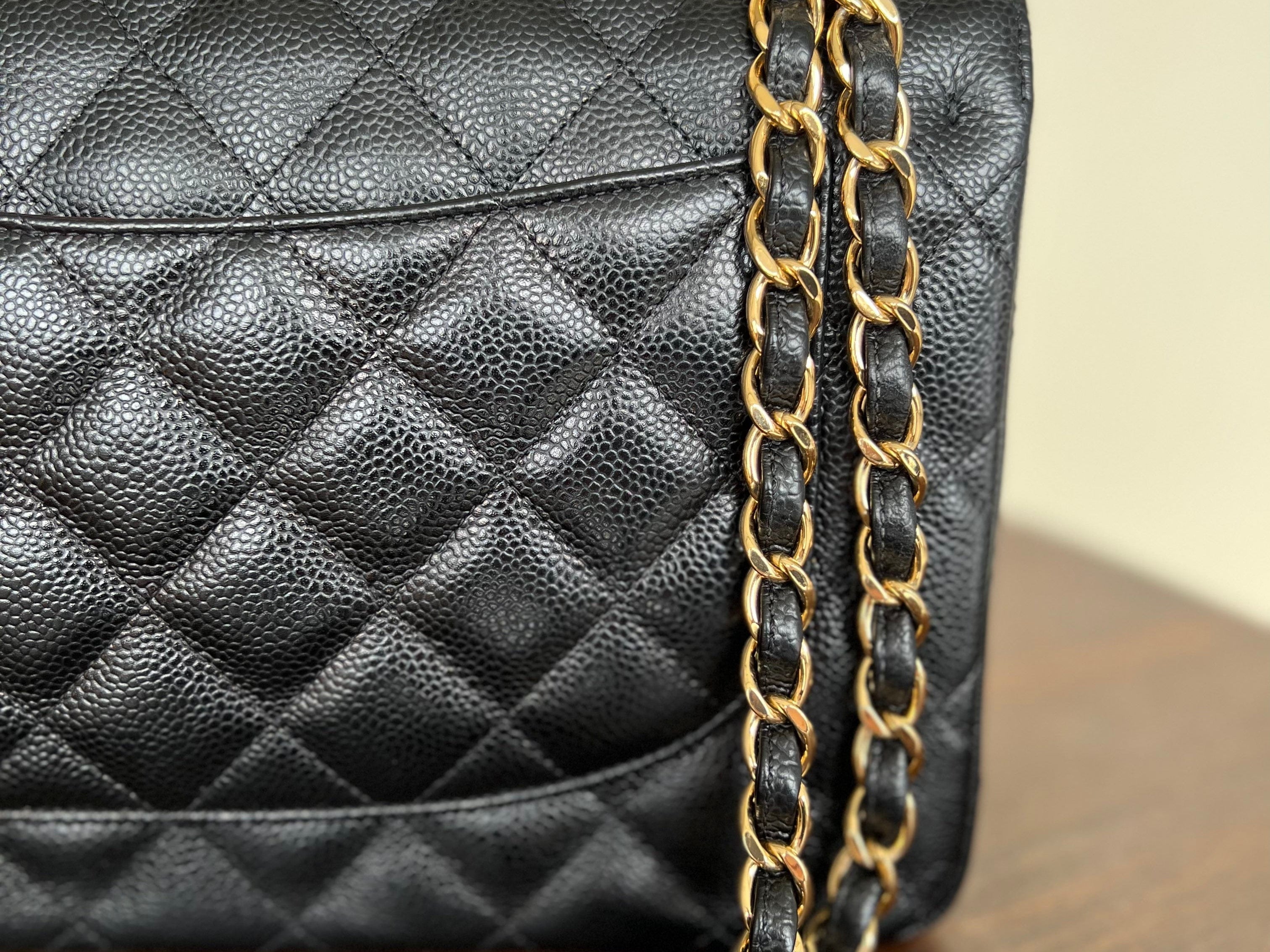 CHANEL Handbag Black Black Caviar Quilted Jumbo Classic Flap Gold Hardware - Redeluxe