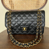 CHANEL Handbag Black Black Caviar Quilted Jumbo Classic Flap Gold Hardware - Redeluxe