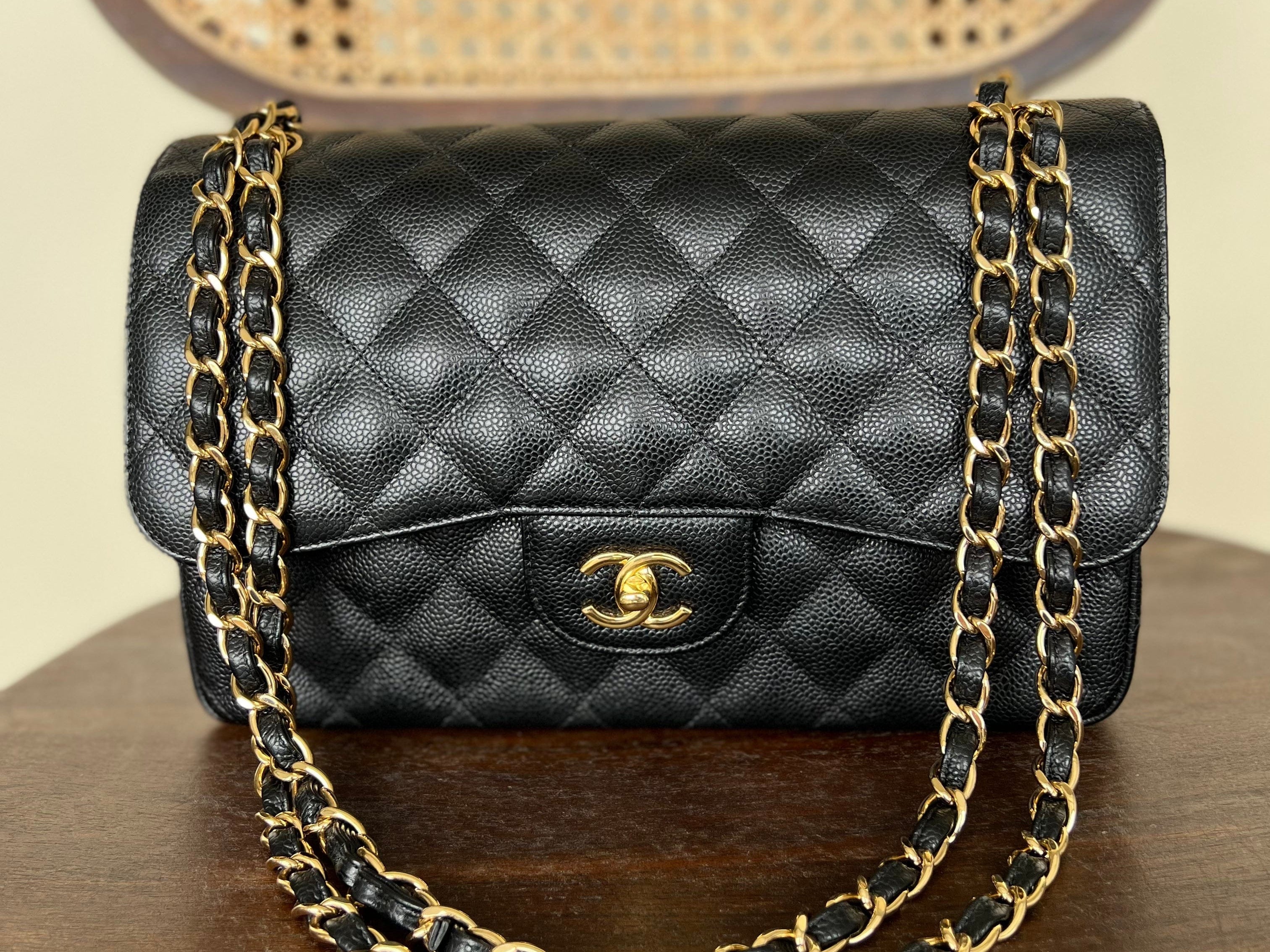 CHANEL Handbag Black Black Caviar Quilted Jumbo Classic Flap Gold Hardware - Redeluxe