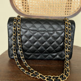 CHANEL Handbag Black Black Caviar Quilted Jumbo Classic Flap Gold Hardware - Redeluxe