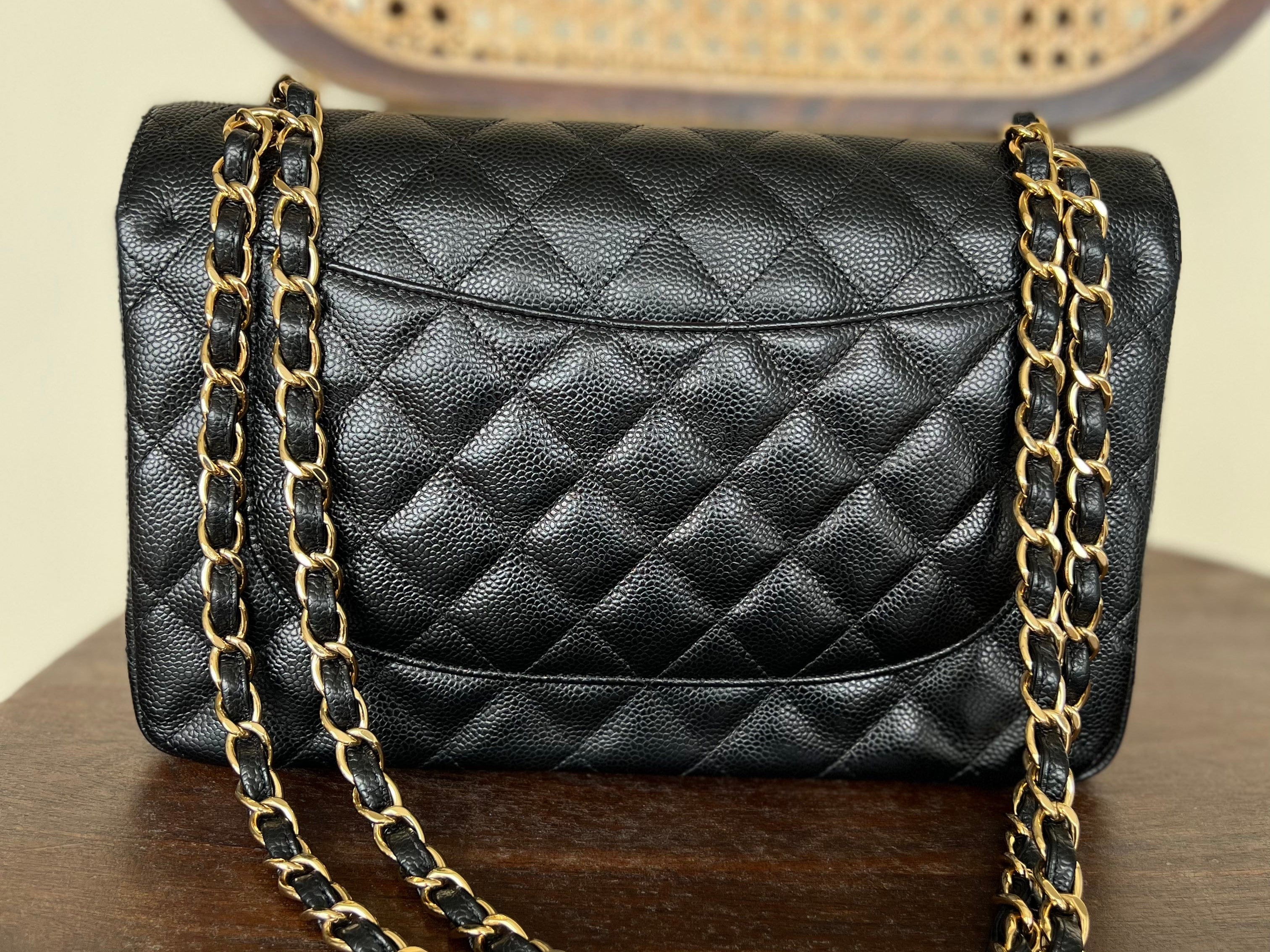 CHANEL Handbag Black Black Caviar Quilted Jumbo Classic Flap Gold Hardware - Redeluxe
