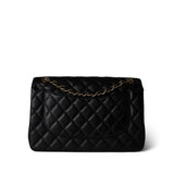 CHANEL Handbag Black Black Caviar Quilted Jumbo Classic Flap Gold Hardware - Redeluxe