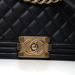 CHANEL Handbag Black Black Lambskin Quilted New Medium Boy Bag Aged Gold Hardware - Redeluxe