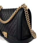 CHANEL Handbag Black Black Lambskin Quilted New Medium Boy Bag Aged Gold Hardware - Redeluxe