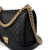 CHANEL Handbag Black Black Lambskin Quilted New Medium Boy Bag Aged Gold Hardware - Redeluxe