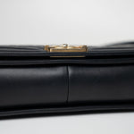 CHANEL Handbag Black Black Lambskin Quilted New Medium Boy Bag Aged Gold Hardware - Redeluxe