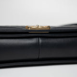 CHANEL Handbag Black Black Lambskin Quilted New Medium Boy Bag Aged Gold Hardware - Redeluxe