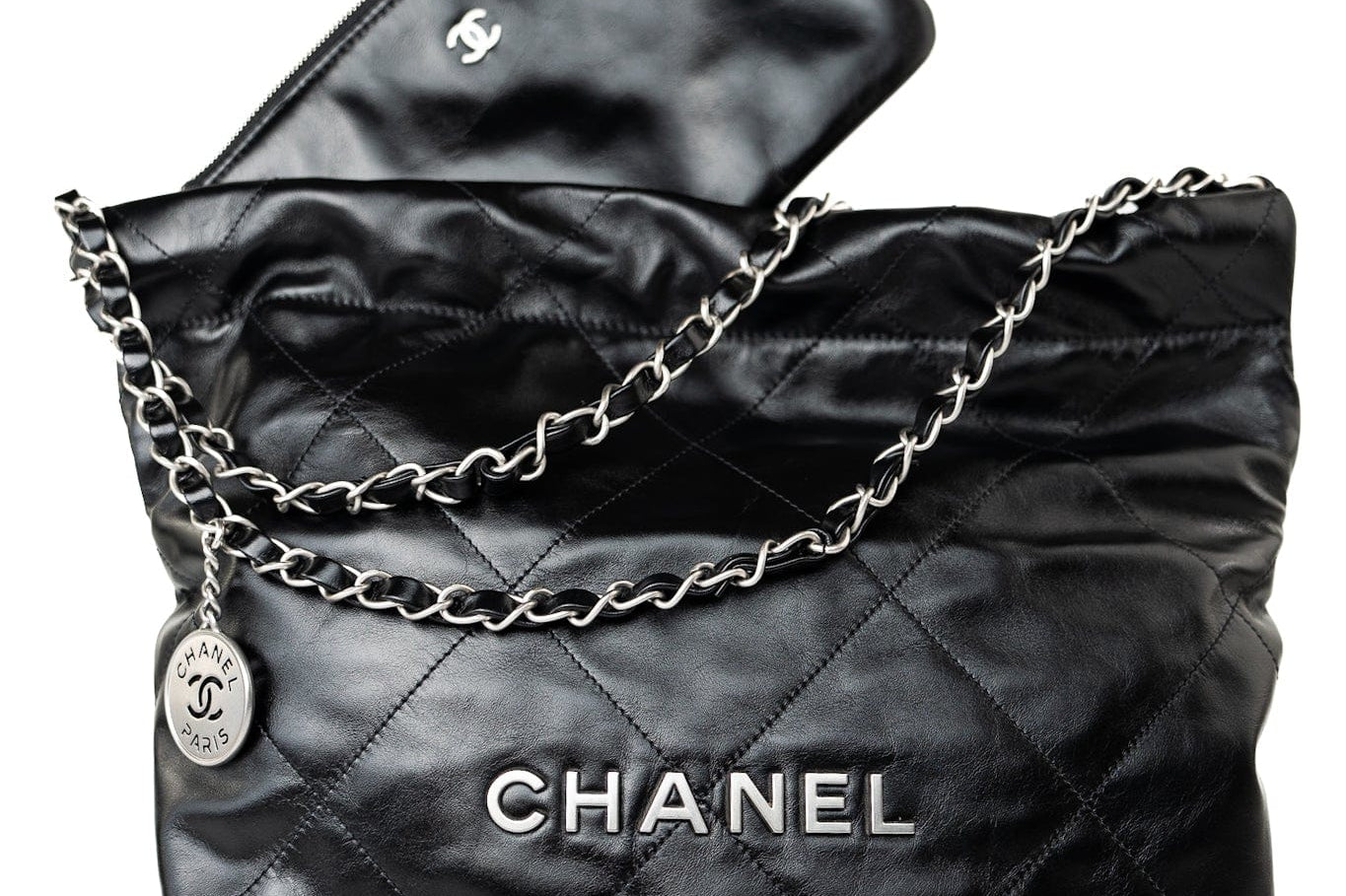 CHANEL Handbag Black Calfskin Quilted Drawstring 22 Bag Small Antique Silver Hardware - Redeluxe