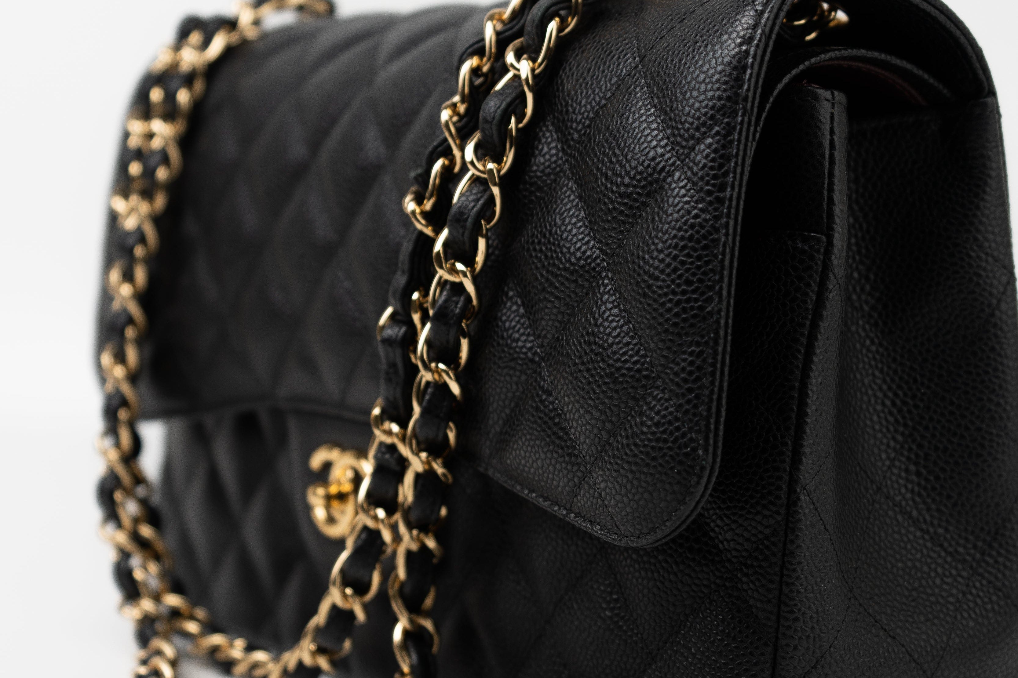 CHANEL Handbag Black Caviar Quilted Jumbo Classic Flap GHW - Redeluxe
