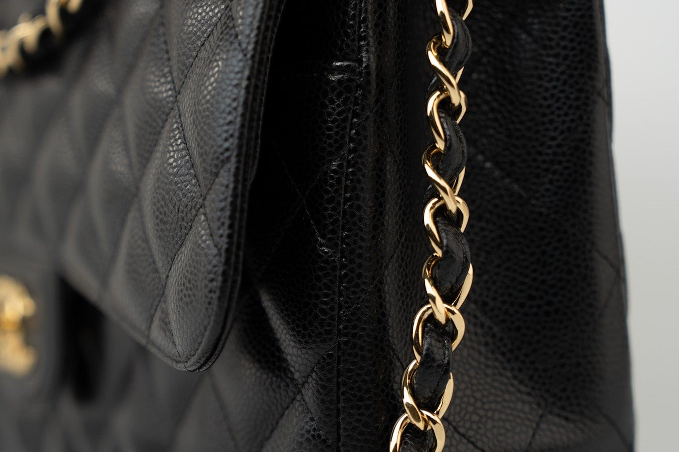 CHANEL Handbag Black Caviar Quilted Jumbo Classic Flap Gold Hardware - Redeluxe
