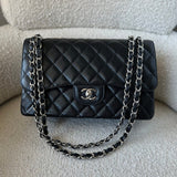CHANEL Handbag Black Caviar Quilted Jumbo Classic Flap Silver Hardware - Redeluxe