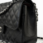 CHANEL Handbag Black Jumbo Caviar Quilted Classic Flap Silver Hardware - Redeluxe