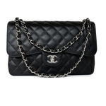 CHANEL Handbag Black Jumbo Caviar Quilted Classic Flap Silver Hardware - Redeluxe