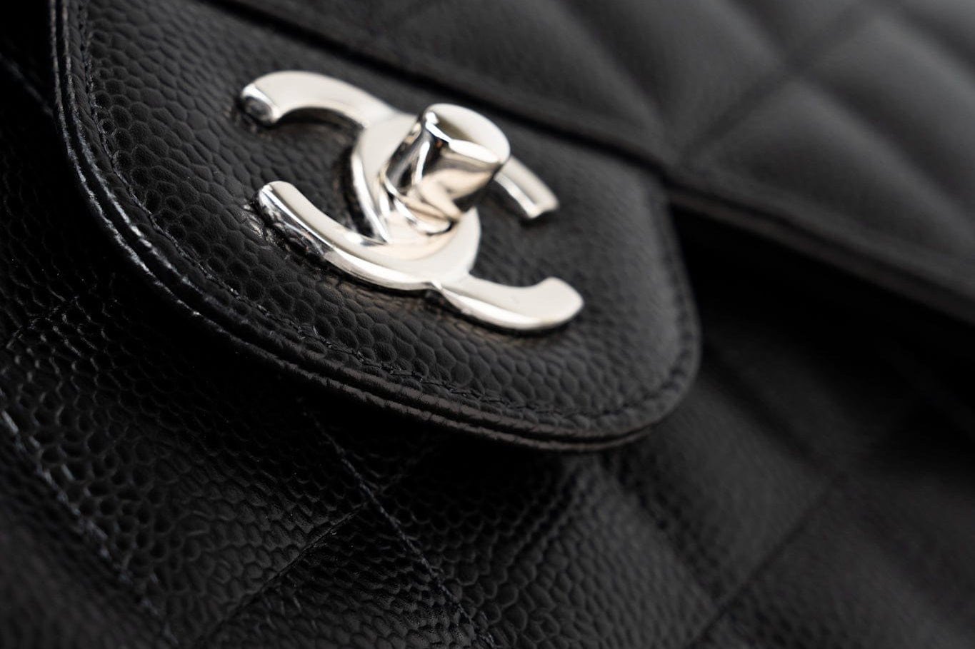 CHANEL Handbag Black Jumbo Caviar Quilted Classic Flap Silver Hardware - Redeluxe