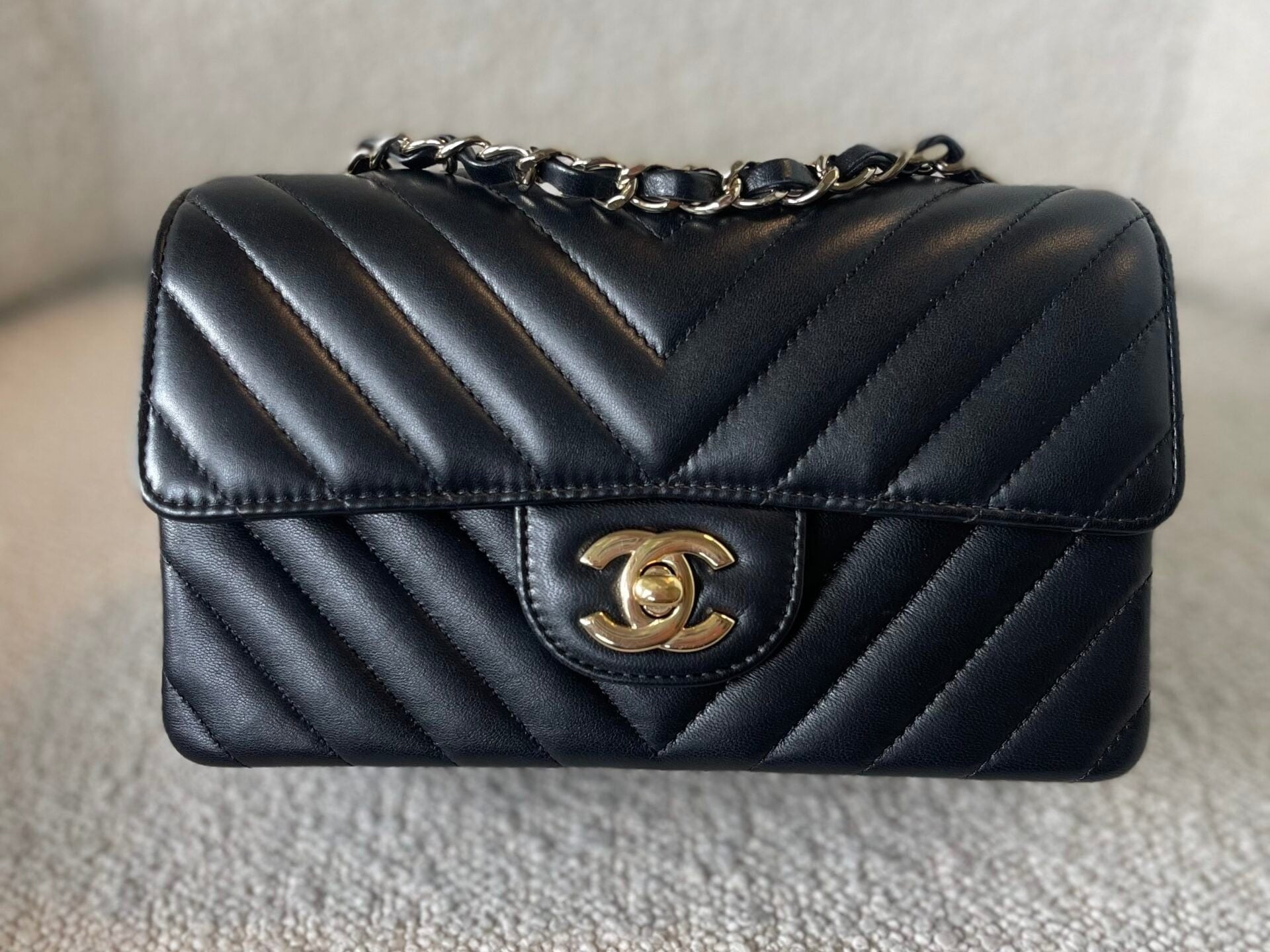CHANEL Handbag Black Mini Rectangular Lambskin Chevron Light Gold Hardware - Redeluxe