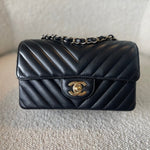 CHANEL Handbag Black Mini Rectangular Lambskin Chevron Light Gold Hardware - Redeluxe
