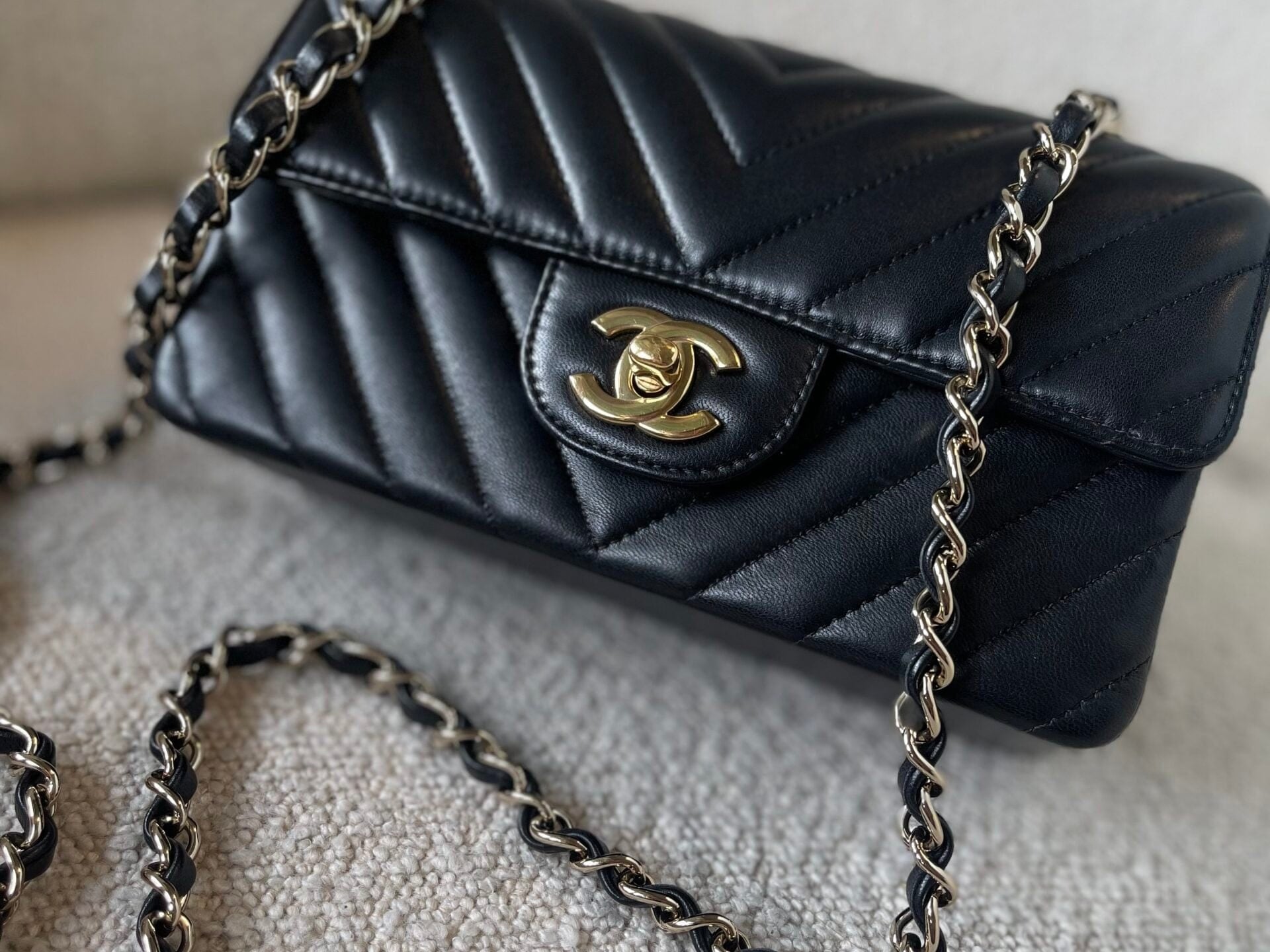 CHANEL Handbag Black Mini Rectangular Lambskin Chevron Light Gold Hardware - Redeluxe