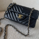 CHANEL Handbag Black Mini Rectangular Lambskin Chevron Light Gold Hardware - Redeluxe