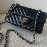 CHANEL Handbag Black Mini Rectangular Lambskin Chevron Light Gold Hardware - Redeluxe