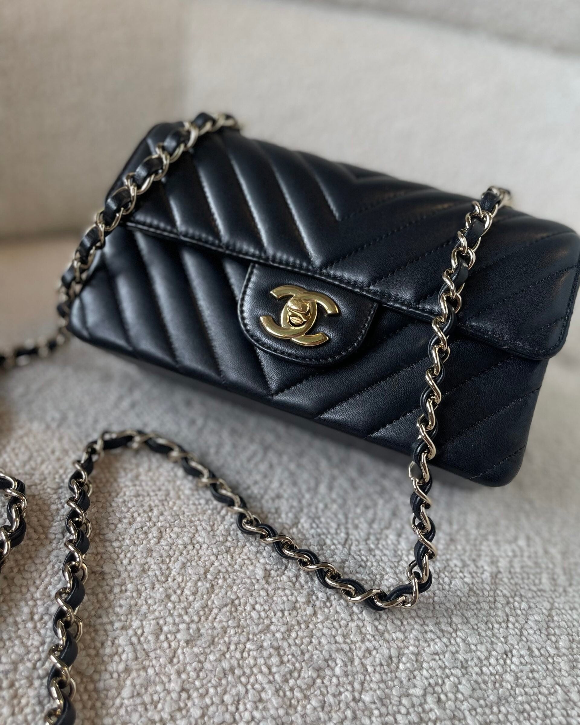 CHANEL Handbag Black Mini Rectangular Lambskin Chevron Light Gold Hardware - Redeluxe