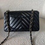 CHANEL Handbag Black Mini Rectangular Lambskin Chevron Light Gold Hardware - Redeluxe