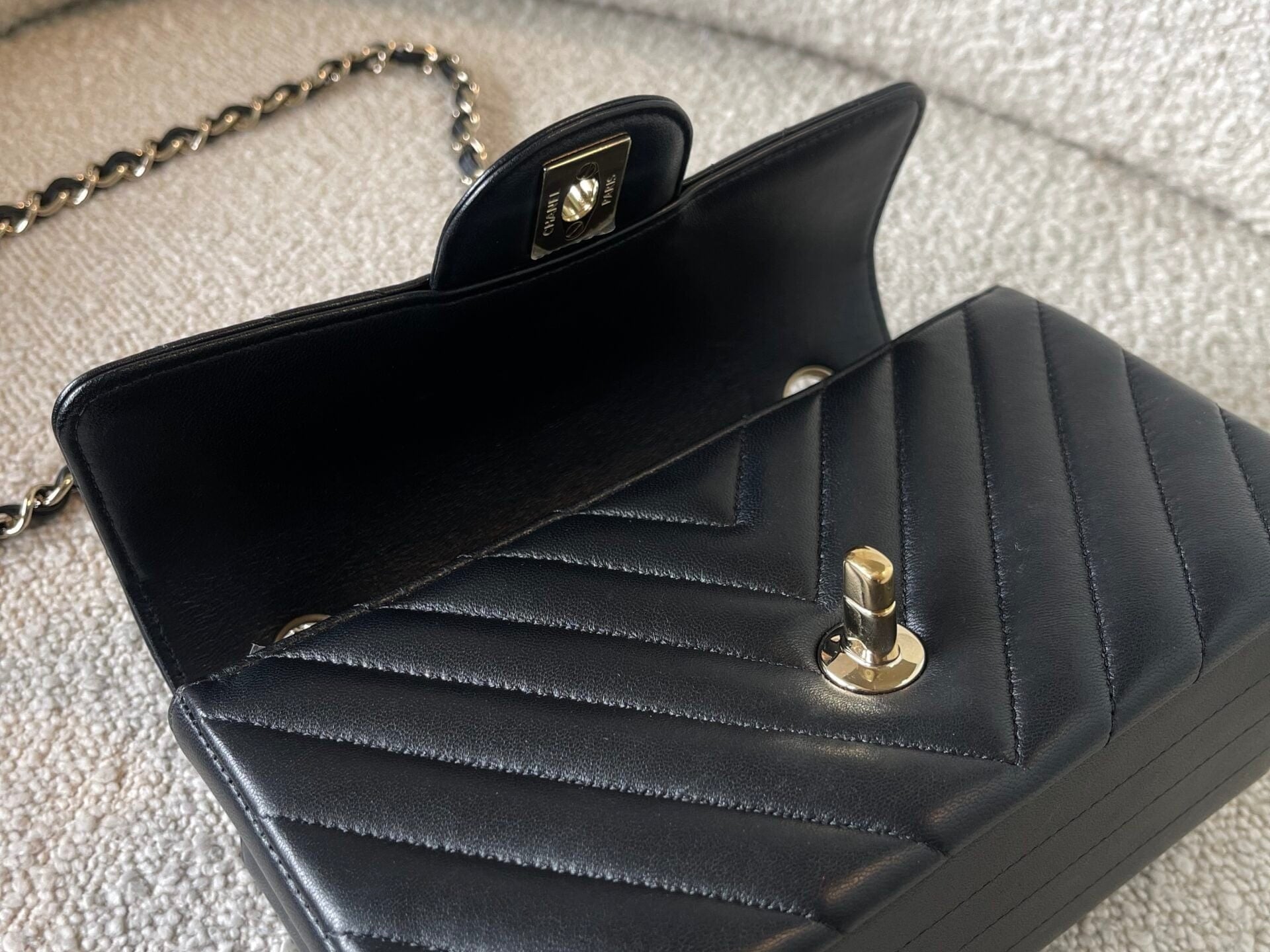 CHANEL Handbag Black Mini Rectangular Lambskin Chevron Light Gold Hardware - Redeluxe