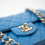 CHANEL Handbag Blue 20S Blue Caviar Quilted Classic Flap Medium Light Gold Hardware - Redeluxe